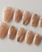 Poetic Glamour Nude press-on nails in extra short almond shape — nude french tip gold line