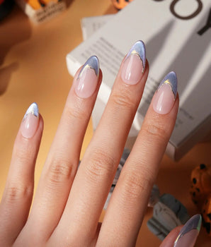 Polaris chrome French press on nails, nude base with an icy blue silver tip and a gold hand-drawn line - image 1