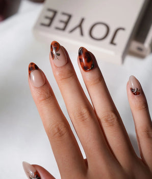 Pumpkin Patch fall tortoise press-on nails with amber swirls and gold line handmade by Joyee Nails