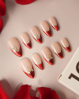 Bow French press-on nails — nude base red chrome french gold outline bow accent handmade nail art by Joyee Nails