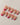 Red nails with 3D flower for a striking and stylish finish