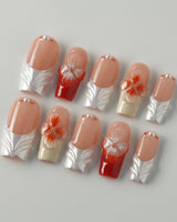 Duchess Marigold orange press-on nails with 3D floral French tips