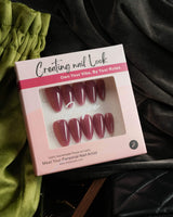 Rose Brew handmade press-on nails featuring Maroon cat eye nails
