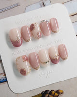 Rose-Théâtre Noir press-on nails in short oval shape — Elegant Rose Pink, Embossed Florals & Metallic Edging.