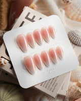 Rosy Glow glossy pink cat-eye nails with blush, champagne, and soft violet shift