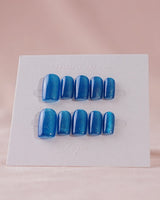 Blue Sky Cat-eye press-on nails in short square shape — Peacock Blue cat eye
