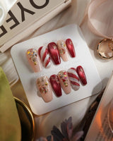 Ruby Night press-on nails in medium coffin shape — Glitzy Red & Gold Christmas, 3D Cat-eye Swirls & Glitter Christmas Trees.