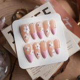 Sakura Fall handmade press-on nails featuring Pink French, White Floral.