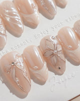 Satin Dress handmade press-on nails featuring nude pink pearl sheen 3D floral ribbon embossed