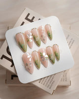Shell Blossom nail art close-up showing Gentle Pink & Green Gradient, Shell Fragment Petals & Hand-painted Leaves. details