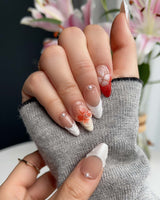 Close-up of Duchess Marigold showing raised orange French florals and transparent gel detail