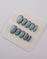 Spinning Aurora press-on nails in short oval shape — Gradient Duo-chrome Cat-eye with Blue-Green and Pink-Purple Shift
