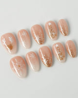 Silent Night press-on nails in extra short almond shape — Champagne Gold Glitter, Christmas Reindeer & Snowflakes.