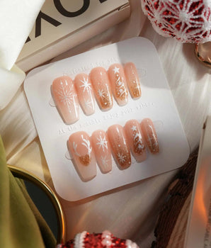 Silent Night handmade press-on nails featuring Champagne Gold Glitter, Christmas Reindeer & Snowflakes.