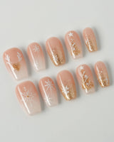 Silent Night press-on nails in short coffin shape — Champagne Gold Glitter, Christmas Reindeer & Snowflakes.