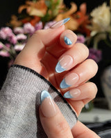 Silk Azure nail art close-up showing Ice Blue Cat Eye, French Silver Wire. details