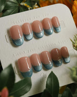 Silk Azure press-on nails in short oval shape — Ice Blue Cat Eye, French Silver Wire.