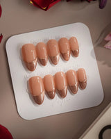 Silk Mousse press-on nails in medium almond shape — Champagne Cat Eye, French Silver Wire.