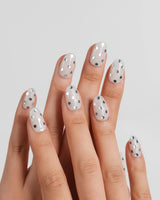 Silver Rain sleek polka dot nails with mercury-like chrome dots on glassy gel