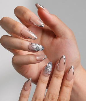 Silver Shore handmade press-on nails featuring Nude & Silver Chrome, 3D Metallic Flower. French nails