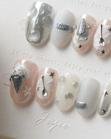 Silver Spoon metallic dessert nail art with silver ice cream cone, stars, and butterflies