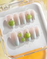 Slushie Apple close-up of juicy 3D apple charms on shimmering blue gradient gel