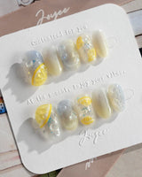 Slushie Lemon minimal fruit nails with translucent slushie texture and yellow citrus charm