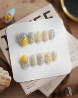 Slushie Lemon extra short oval nails with frozen glass shimmer and lemon slice art