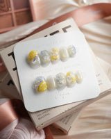 Slushie Lemon extra short squoval nails with icy glitter and 3D lemon soda accents