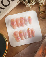 Slushie Peach glossy summer nails with pink shimmer, peach slices, and dew bubbles
