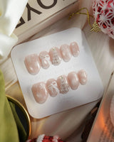 Snowfall press-on nails — pearl nude cat eye snowflake bow silver glitter soft sheen handmade nail art by Joyee Nails