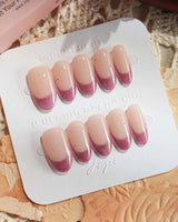 Soft Glow press-on nails in medium oval shape — Pinkish Purple Cat Eye, French Glittery Stars.