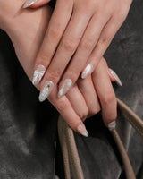 Snowfall press-on nails — pearl nude cat eye snowflake bow silver glitter soft sheen handmade nail art by Joyee Nails