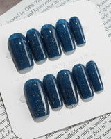 Glitter Glitz Navy press-on nails in medium square shape — deep blue cat eye glitter nails