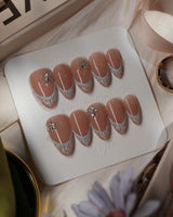 Spotlight Muse nails in short almond — Soft Nude Pink, Silver