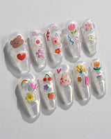 Squishy Pop long coffin nails with playful decals and glossy handmade finish