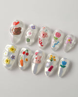 Squishy Pop medium almond nails with cute pop-art accents