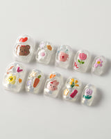 Squishy Pop short square nails with playful decals and glossy gel texture