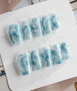 Starry River press-on nails in short coffin shape — Blue & White Marble, Shimmering Cat-eye.