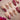 Sugar Thorn press-on nails with classic rose red, 3D metallic rose reliefs and contrast French tips