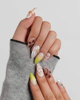 Sun Fossil glossy 3D ocean nails with natural shell gradients and pearl highlights