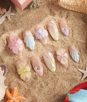 Sunbathing handmade press-on nails featuring Iridescent Nude & Pastels, 3D Oversized Florals & Shells