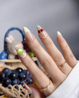 Sunny Mix close-up of 3D mixed fruits on nude French press-on nails