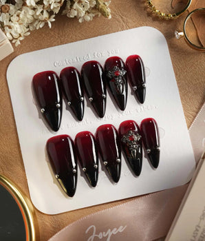 The Curse press-on nails — red to black gradient glossy chrome studs gothic cross charm handmade nail art by Joyee Nails