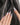 The Cygnus nail art close-up showing silver lilac cat eye feather chrome rhinestone cat eye effect details