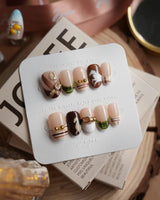 THE HEIR short oval press-on nails with vintage plaid and equestrian horsebit accents