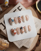 THE REVERIE extra short almond nails with creamy swirls and colorful rocking horse art