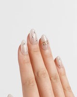 The Vow nail art close-up showing Sheer Shimmering Glitter, Minimalist Silver Studs & Metallic Ring Accents. details