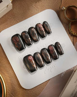 Thorned Spell press-on nails — black cat eye gold outline rose thorn design handmade nail art by Joyee Nails