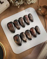 Thorned Spell press-on nails — black cat eye gold outline rose thorn design handmade nail art by Joyee Nails